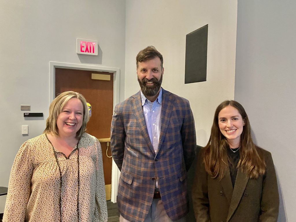 Dr. Jon Hale standing with two colleagues
