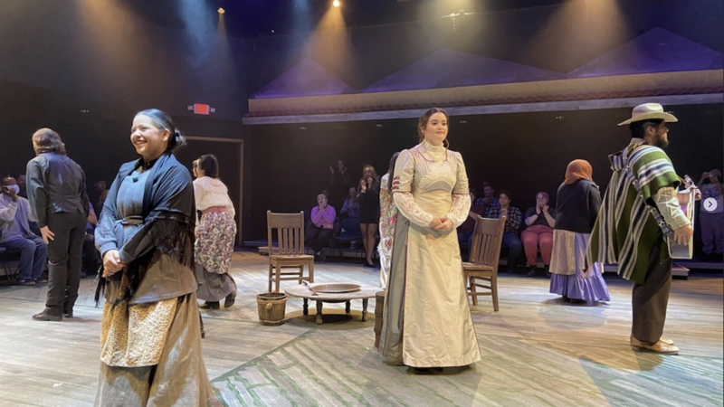 actors bowing on stage