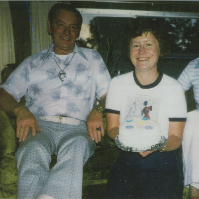 Linda Hughes holding a cake