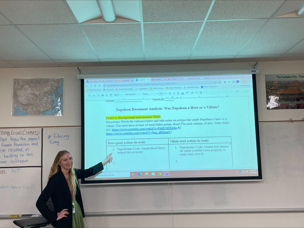 teegardin stands in fornt of a class teaching a lesson on Napolean.