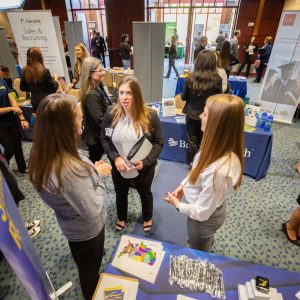 Students and Employers interacting at the career fair.