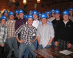 A group of Construction Management students in a group wearing hard hats