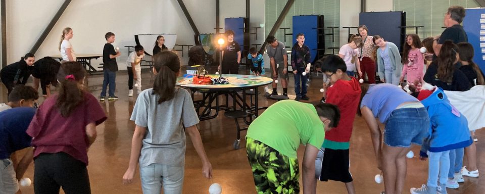 Ed Anderson teaches the phases of the moon with students at Del Norte Elementary School, Roswell, New Mexico.