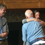 Professor's hug over Dr. Scott's retirement.