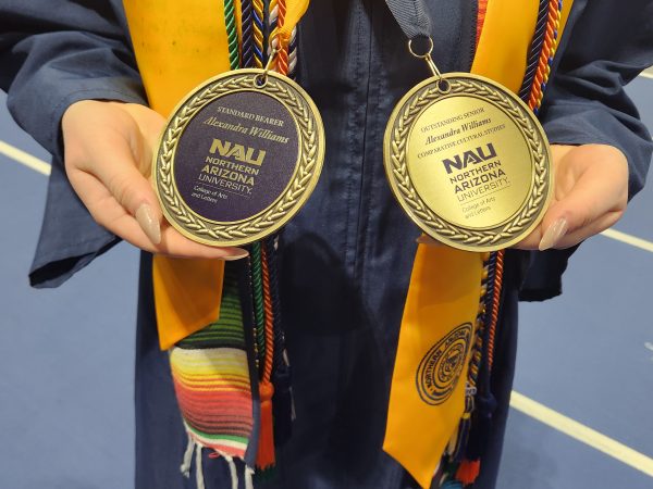 The image shows two brass medals.