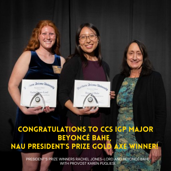 Two women stand holding certificates with a third woman, the university provost. 