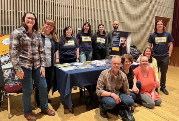 The image shows CCS faculty and students at the CCS table.