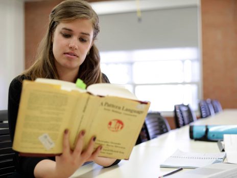 a student reads in a classroom