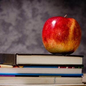 image of apple on books