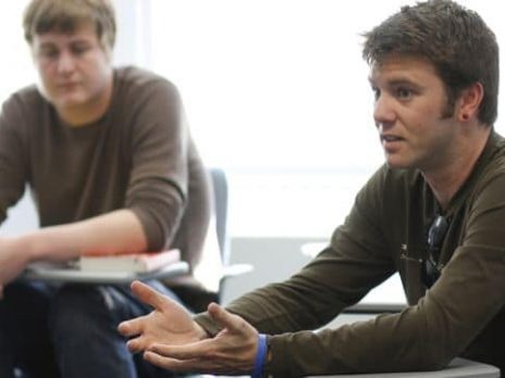 a student talks in a history class