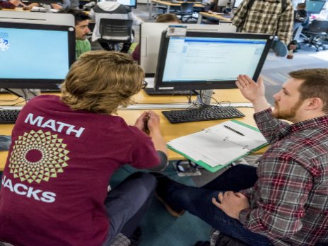 a math tutor helps a student with online homework