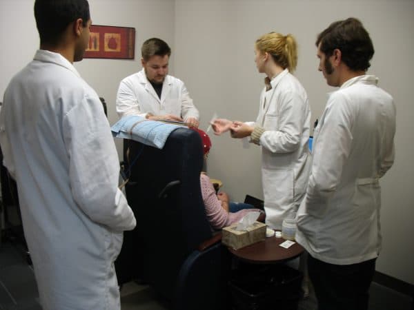 Students in lab conducting EEG study
