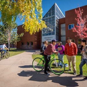 students gather outside a university building