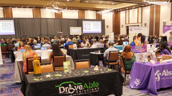 Image of a presentation in a crowded room at the IHD Conference