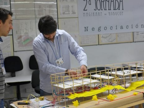 An NAU professor is working with a building model of small scale