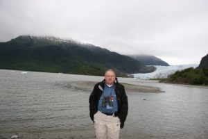 photo of a man in front of the ocean
