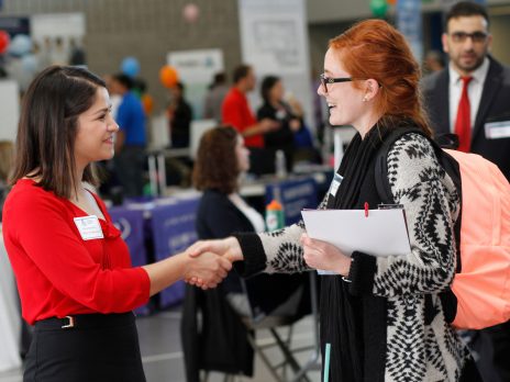 photo of nau students shaking hands