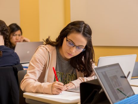 photo of an nau student working at a table 