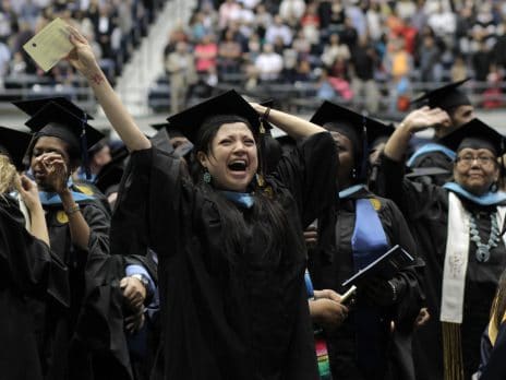 female nau graduate college student shows excitement at close of graduation ceremonies in Flagstaff
