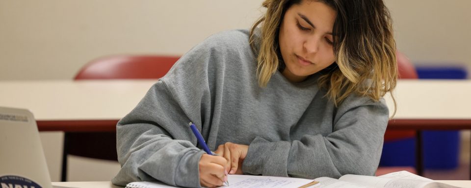 Student taking notes