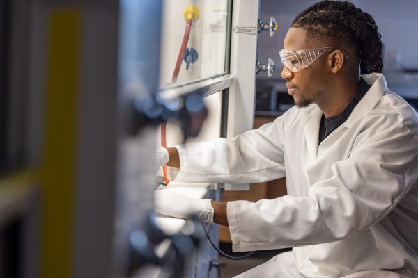 Zachariah Bess working in a lab