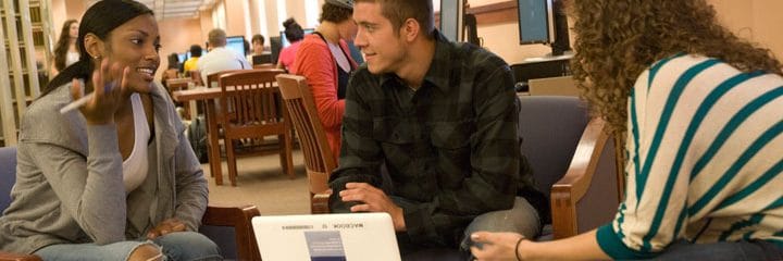 College students in conversation at Library