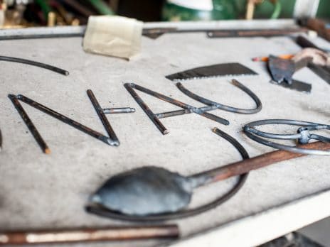 metal scrap spelling out NAU