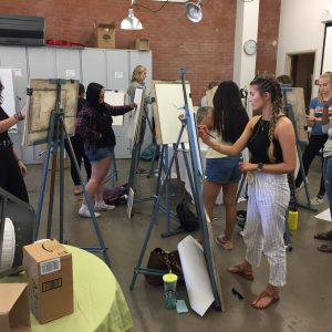 Students drawing at easels in Drawing Fundamentals 1