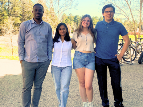 Tochukwu, Chaithanya, Alison, and Hunter pose for a picture together.