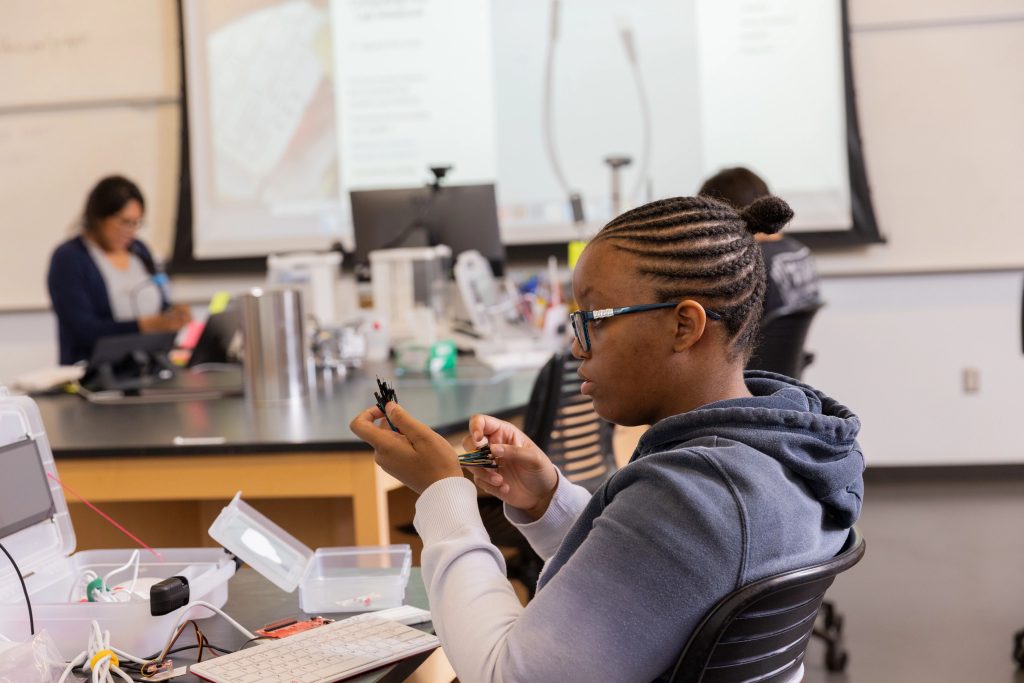 High school student conducting research during the Cultural and Academic Research Experience (CARE) program.