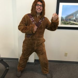 Student worker poses in Star Wars wookie costume in computer lab.