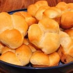 basket of rolls that have been buttered and baked to golden perfection