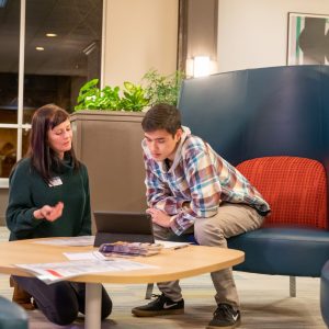 NAU students studying in a campus living community lounge area.