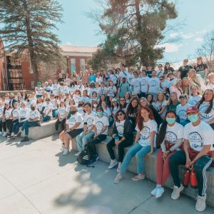 students gathered outside in group photo
