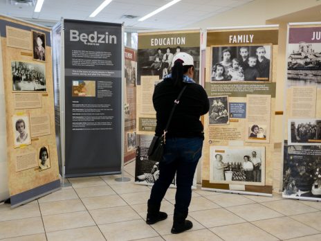 A woman looks at the exhibition ‘Through the Eyes of Youth: Life and Death in the Bedzin Ghetto,’ which is on display at the Hebrew Institute of Riverdale until Jan. 26.