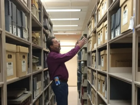 Photo of Sean Evans, an archivist for Cline Library Special Collections. 