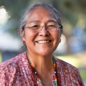 headshot photo of Carol Goldtooth with red shirt
