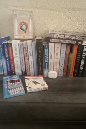 A row of books lined up against a wal