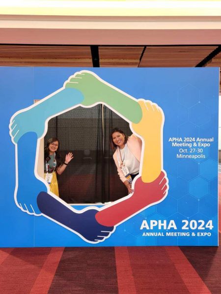 Carmenlita and Jennifer posing at an APHA 2024 decor sign