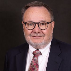 Professional headshot of Dr. Chuck Wiggins