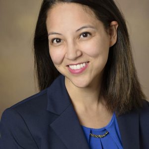 photo of Dr. Melissa Furlong in a blue shirt and dark blue coat