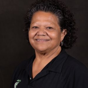 Rosemary Sullivan wearing a black polo and silver earrings