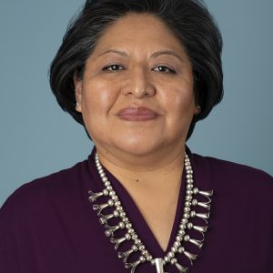 Joette Walters wearing a purple top and silver necklace