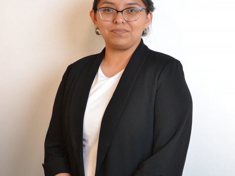MaRiah Peter wearing professional attire with her turquoise jewelry.