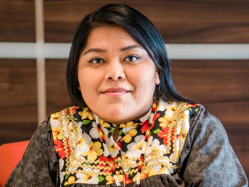 Shannon Taylor wearing her traditional regalia and a beaded necklace