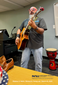 City Councilman Anthony Garcia introduces himself to students with a protest song.