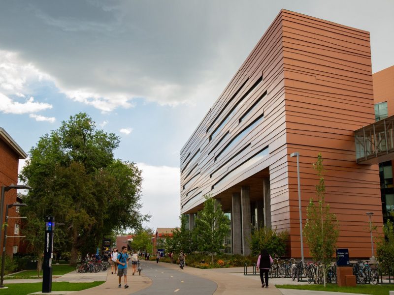 Students walking through pedway between campus buildings.