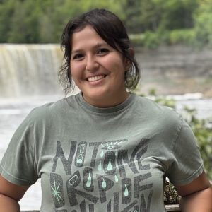 Kaiya AuBuchon in front of a waterfall.