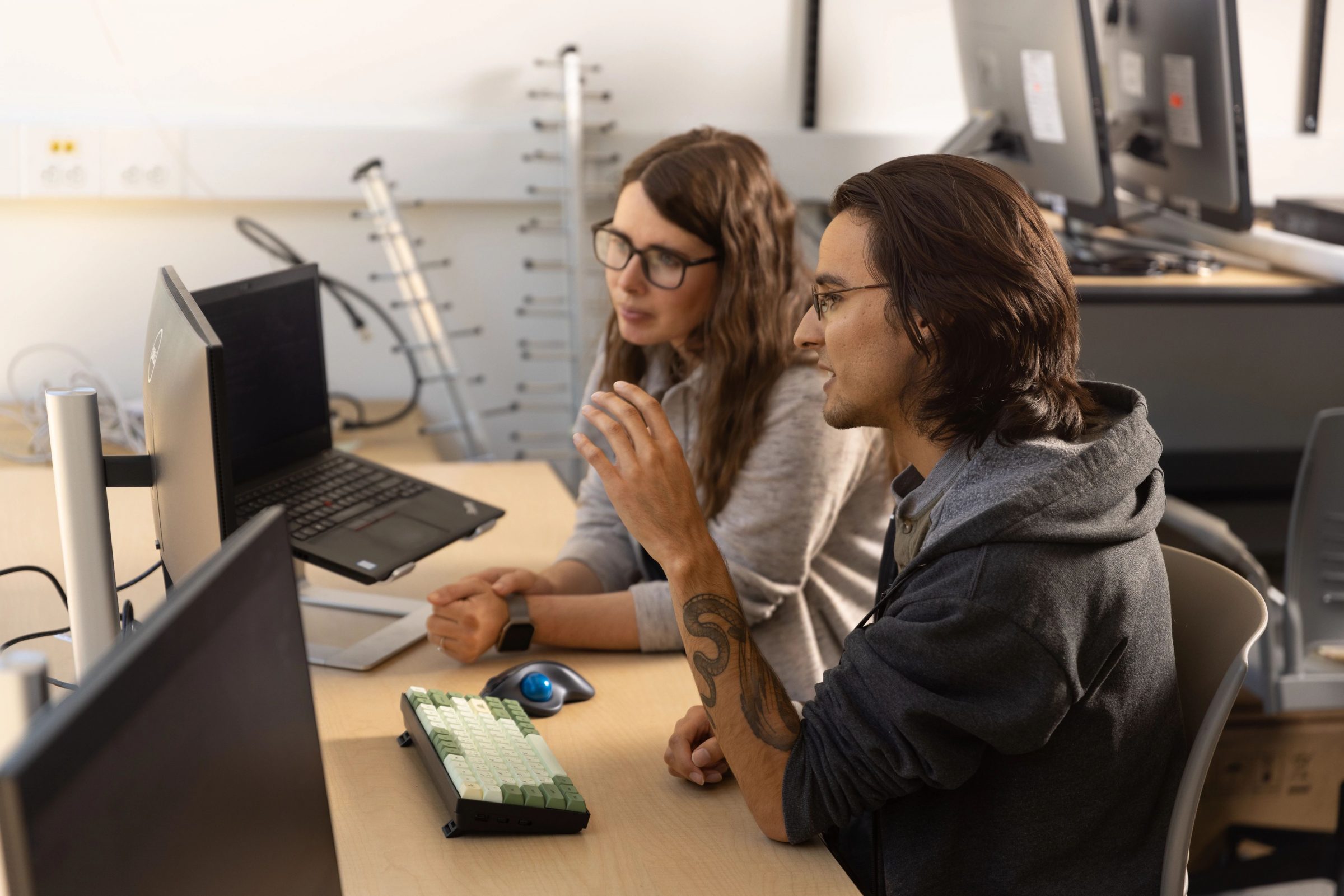 Professor Vigil Hayes working with student.