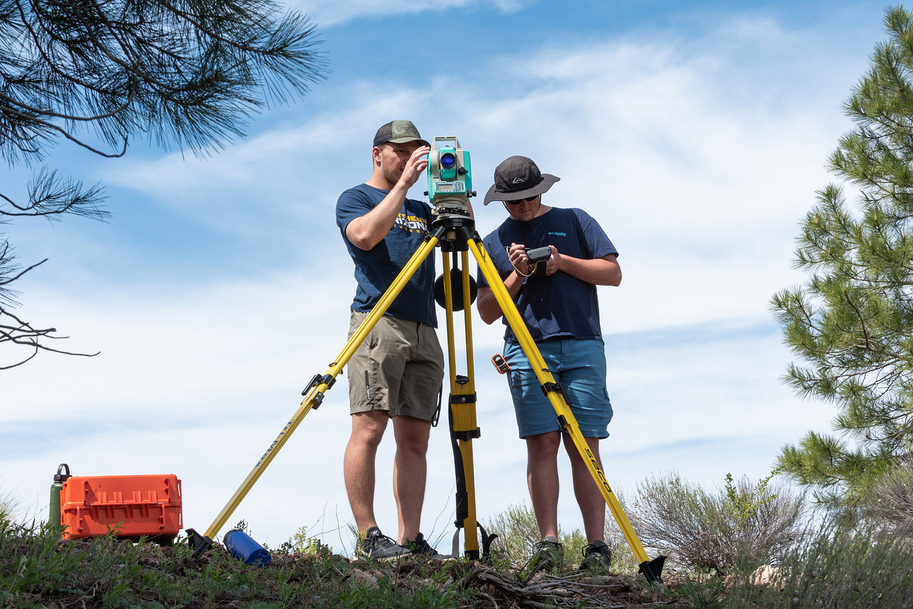 N A U students standing outside and surveying the land.